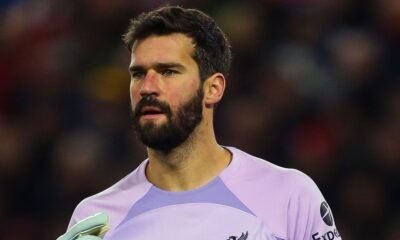 Did VAR swindle Manchester City? Controversially, Ruben Dias's goal is ruled out due to a foul on the Liverpool goalkeeper, and Alisson is relieved after fumbling the ball.